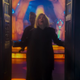 The Thirteenth Doctor opens the TARDIS doors and stars out in wonder.